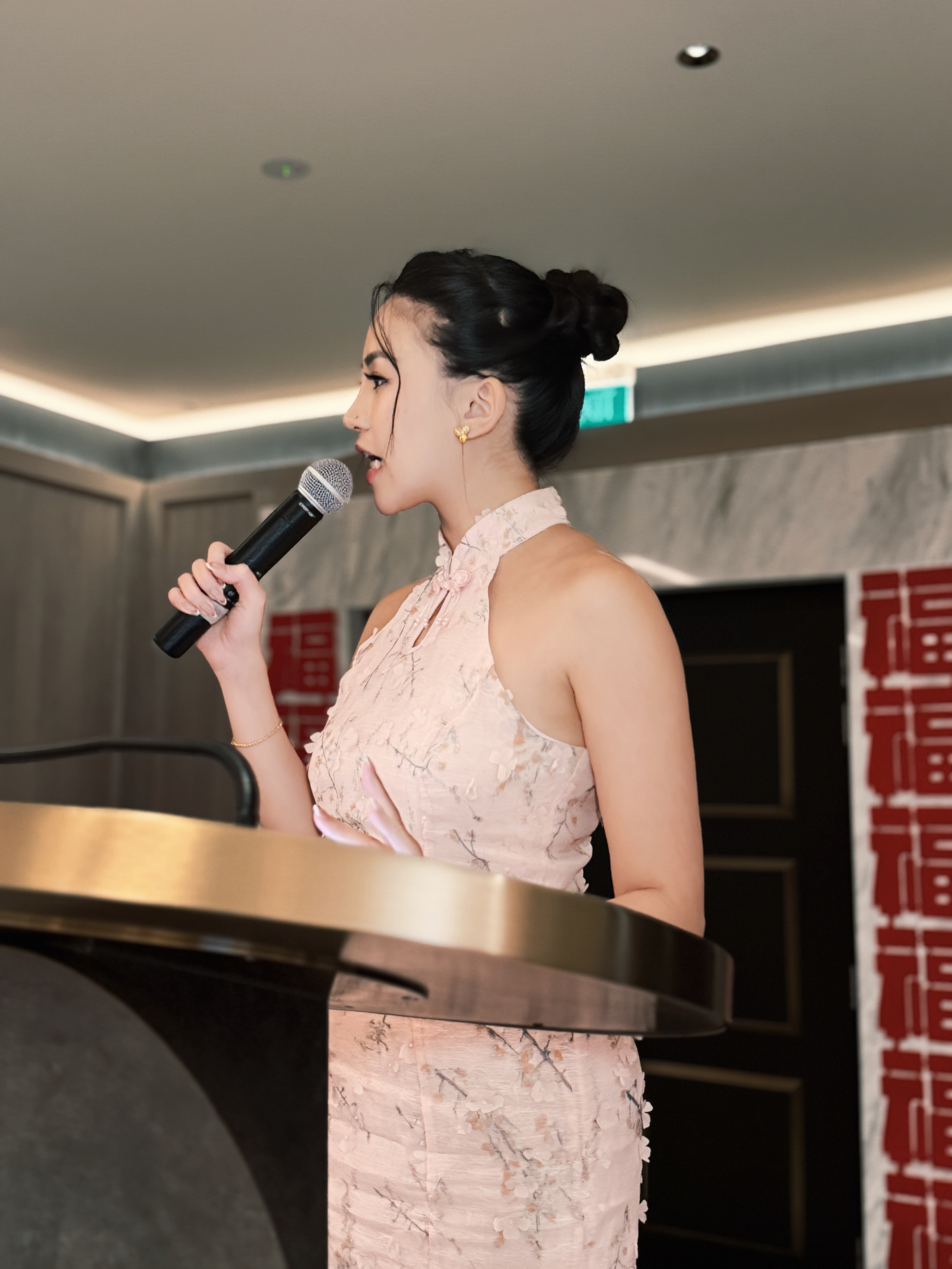 Fiona Loh speaking at a podium
